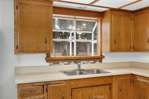 a kitchen with a sink and cabinets