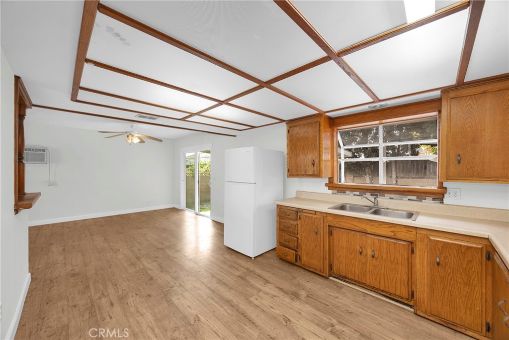 10411 Lexington Street Stanton, CA 90680 - Photo 9 of 30 a view of a kitchen with a sink and wooden floor