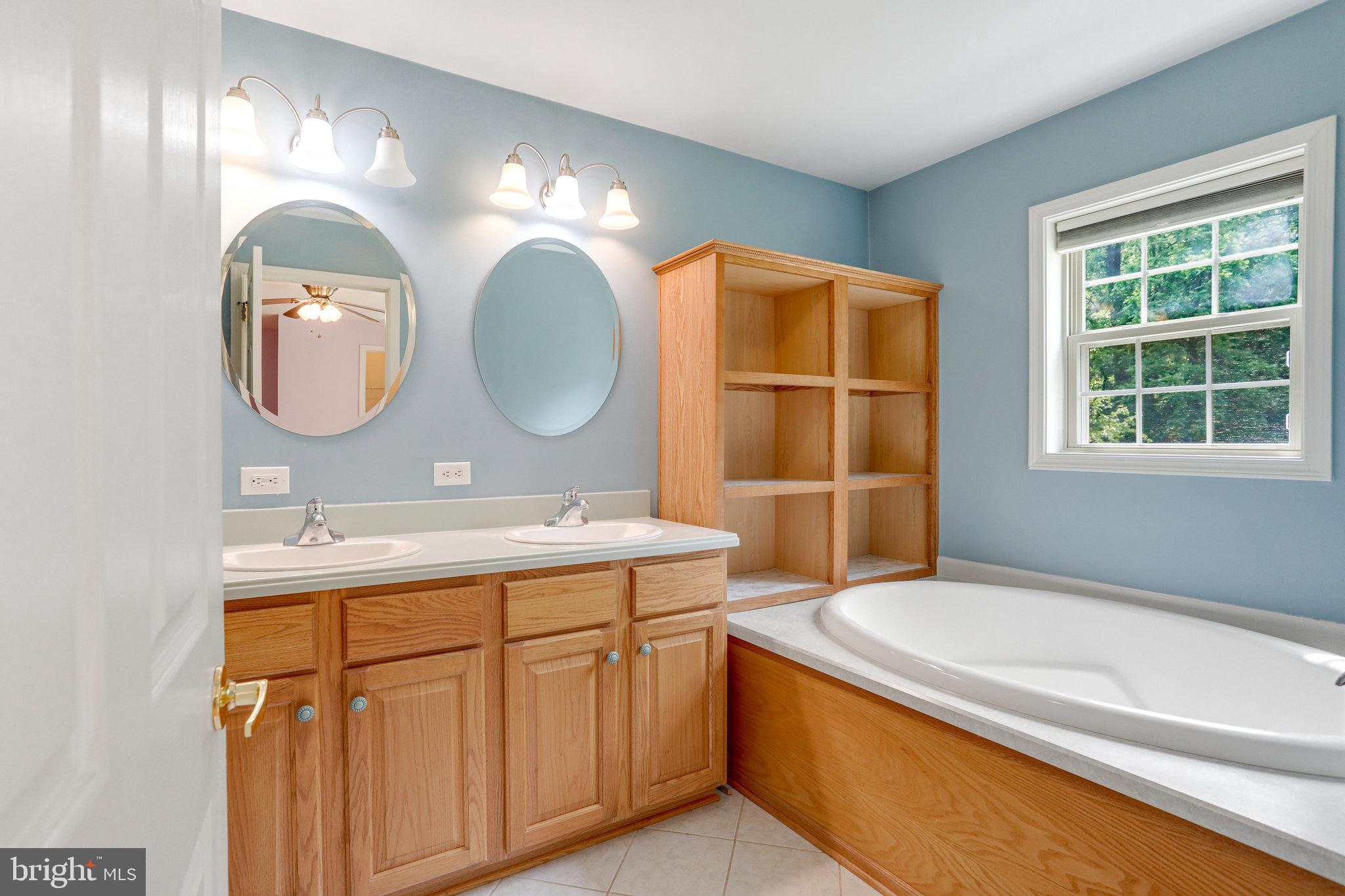 11787 Rowe Road Monrovia, MD 21770 - Photo 20 of 58 Primary bathroom with soaking tub and shower.