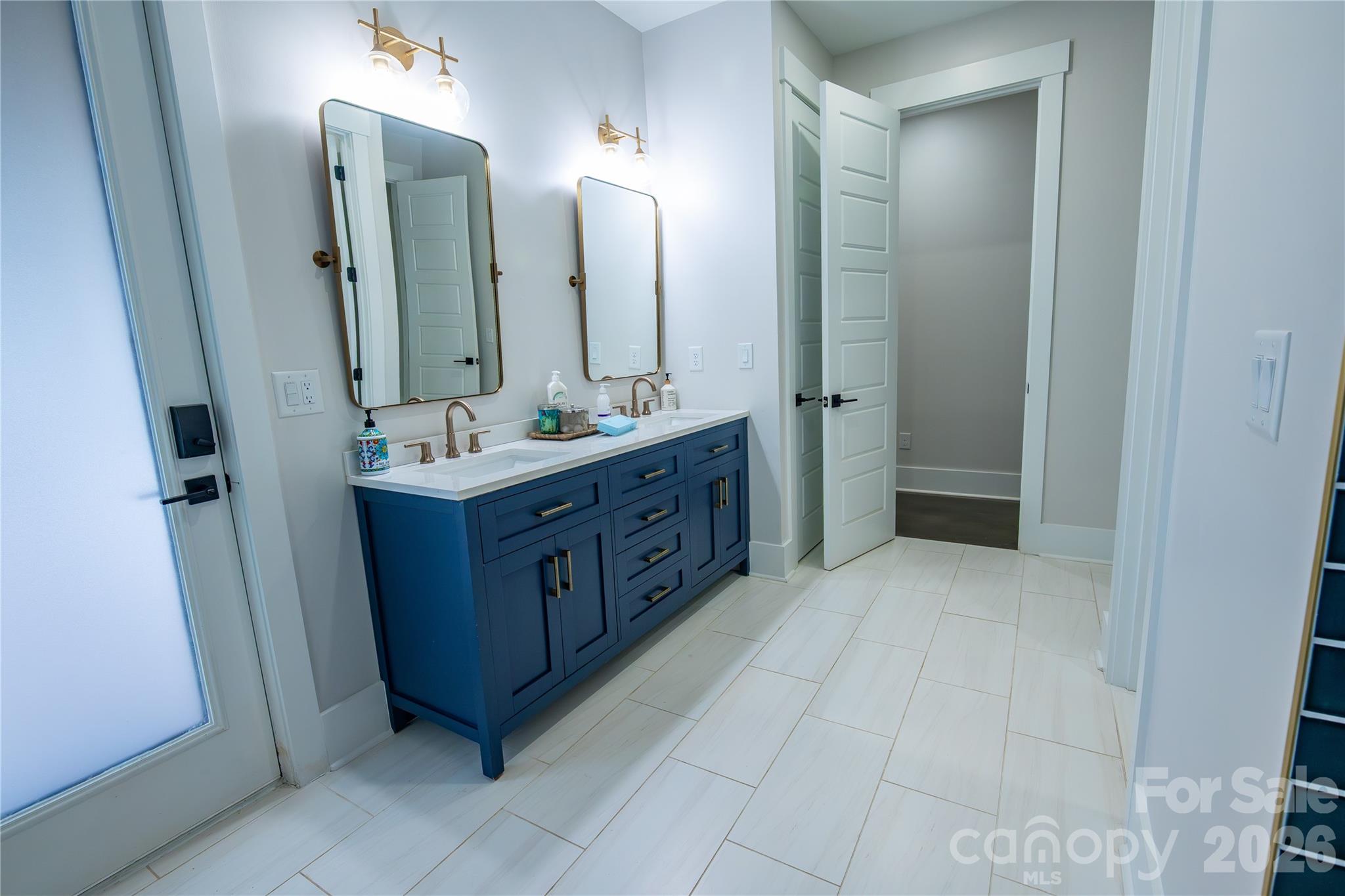 5056 Bridge Way Denver, NC 28037 - Photo 34 of 42 a bathroom with a double vanity sink mirror and double