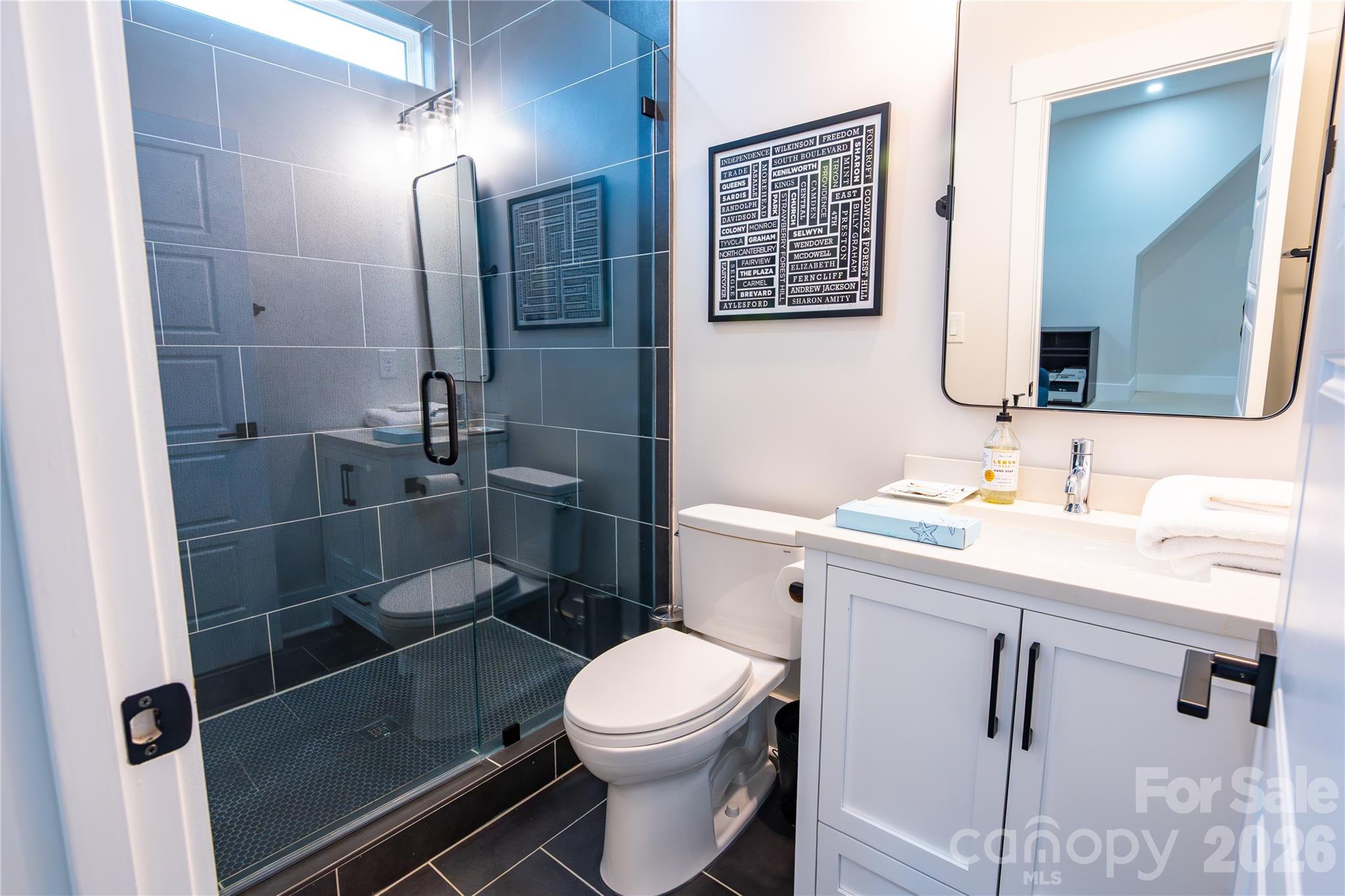 5056 Bridge Way Denver, NC 28037 - Photo 36 of 42 a bathroom with a sink a toilet and shower