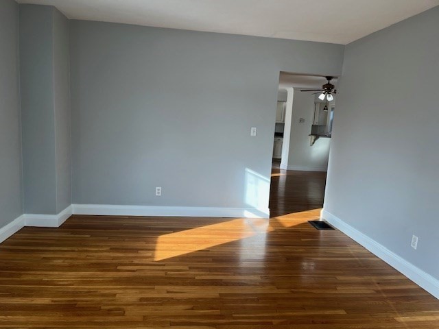 27 Pleasant Street, Unit 1 Middleton, MA 01949 - Photo 13 of 21 a view of empty room with wooden floor
