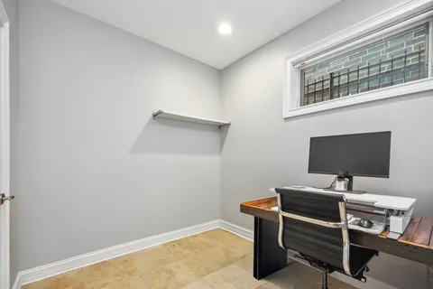 a view of a workspace with furniture