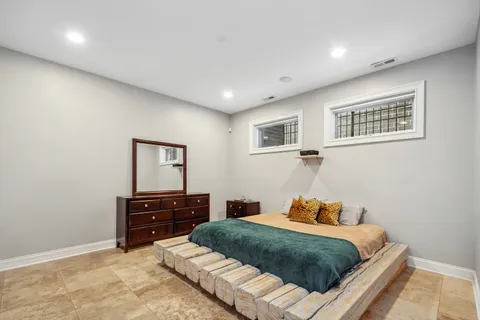 a bedroom with a bed and dresser
