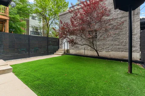 a view of a backyard with a small cabin