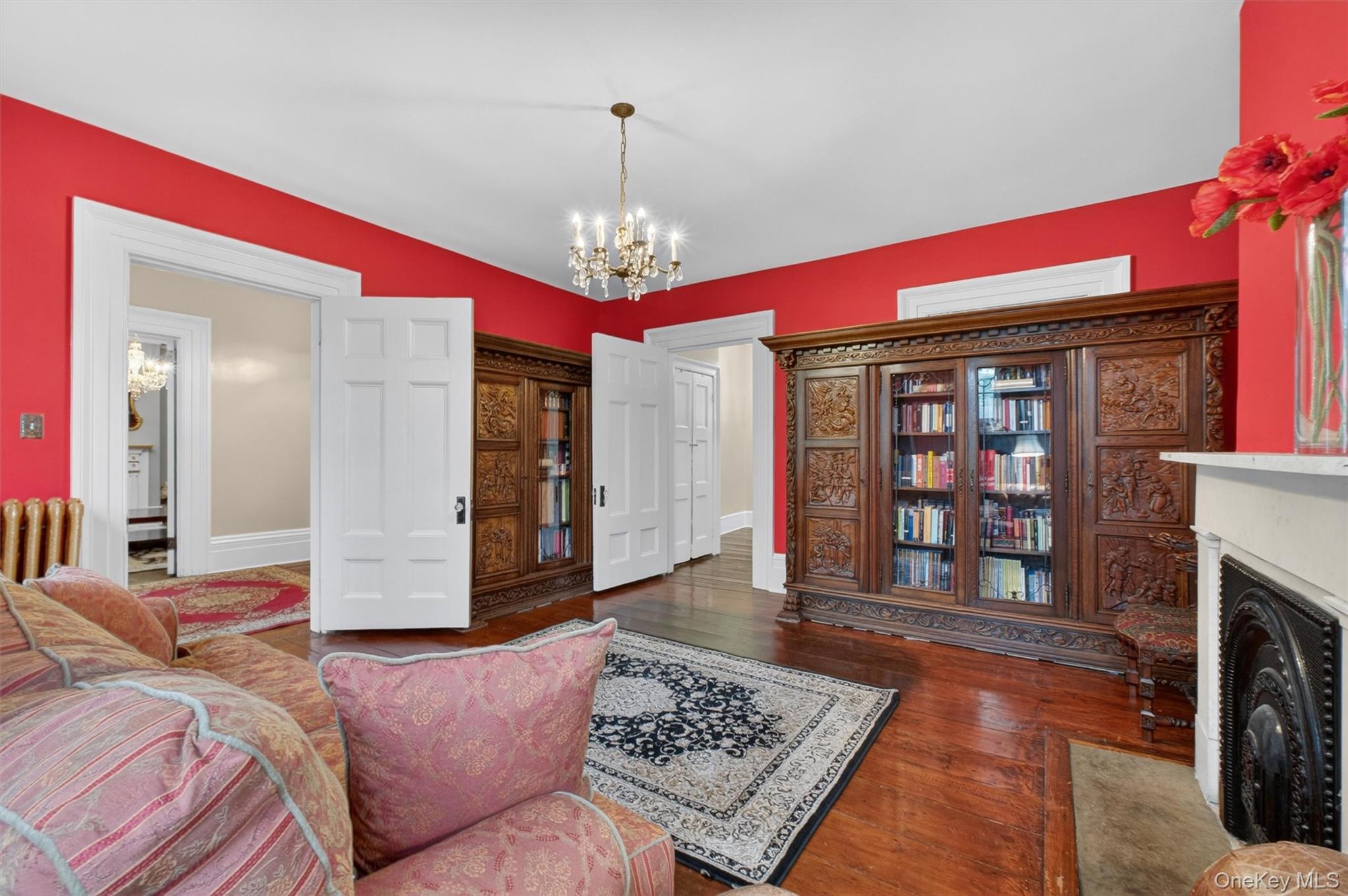 121 Old Glenham Road Fishkill, NY 12524 - Photo 13 of 50 Hardwood flooring throughout, with a fireplace, large windows and doorway leading to other living areas