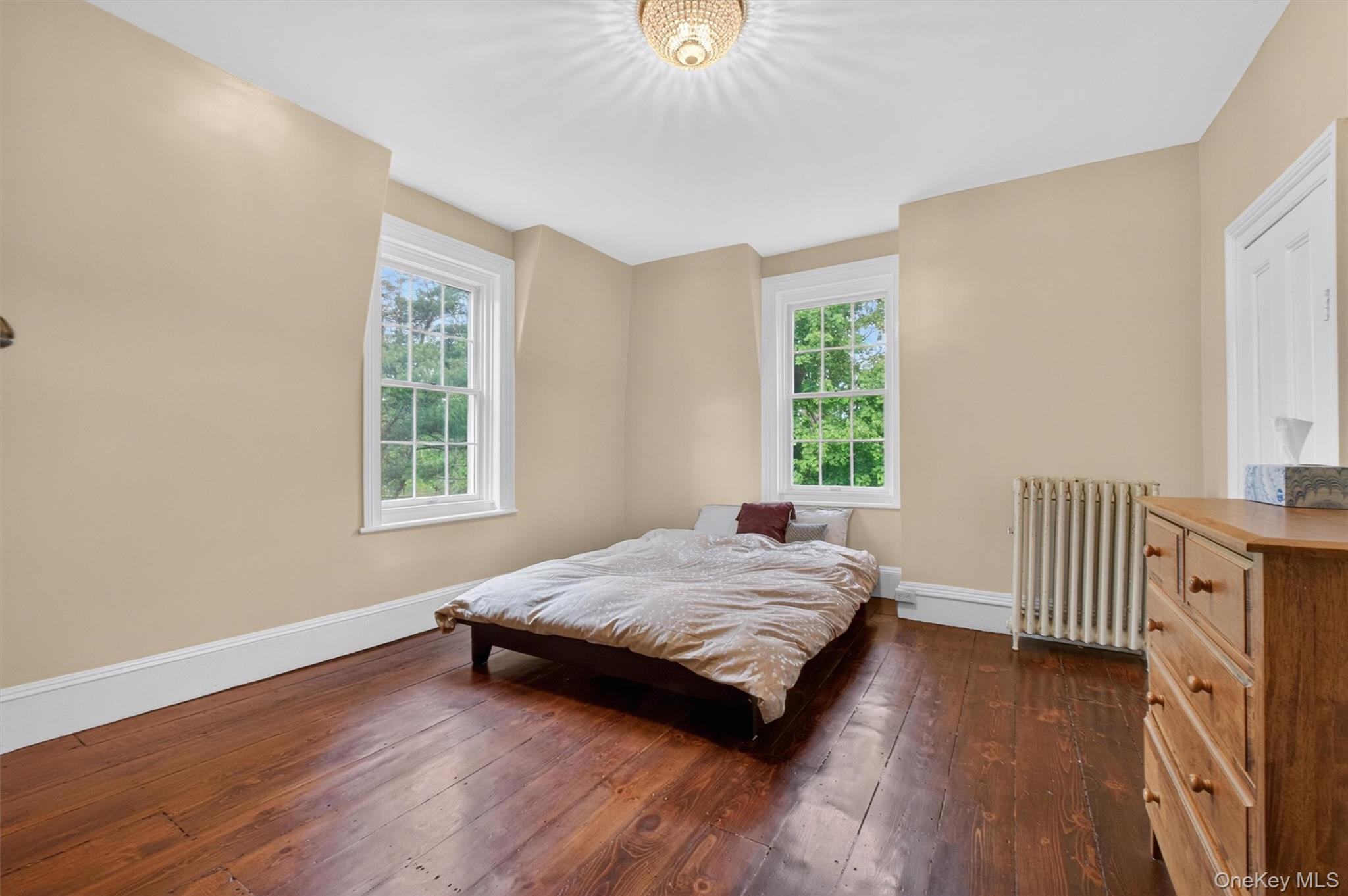 121 Old Glenham Road Fishkill, NY 12524 - Photo 31 of 50 Room featuring wide-plank wood flooring, light-toned walls, white trim,closet, and large windows.