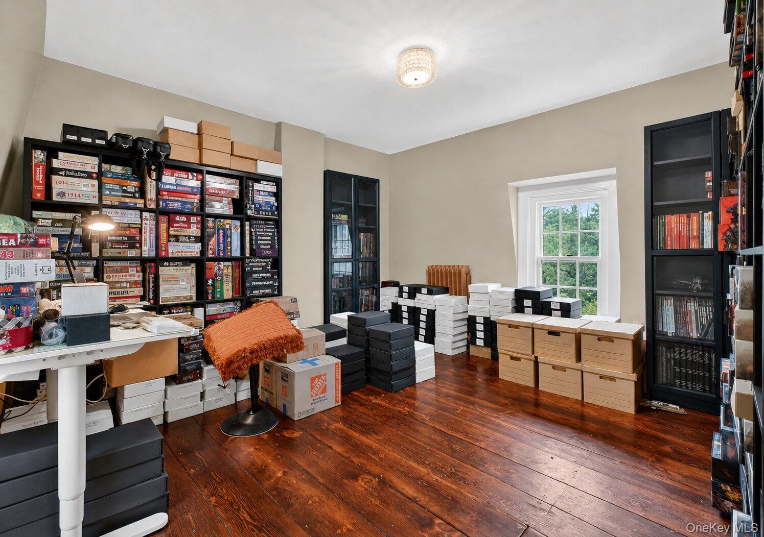 121 Old Glenham Road Fishkill, NY 12524 - Photo 35 of 50 Room featuring rich wood-finish flooring, light tan wall color, a traditional window with white trim and large windows.