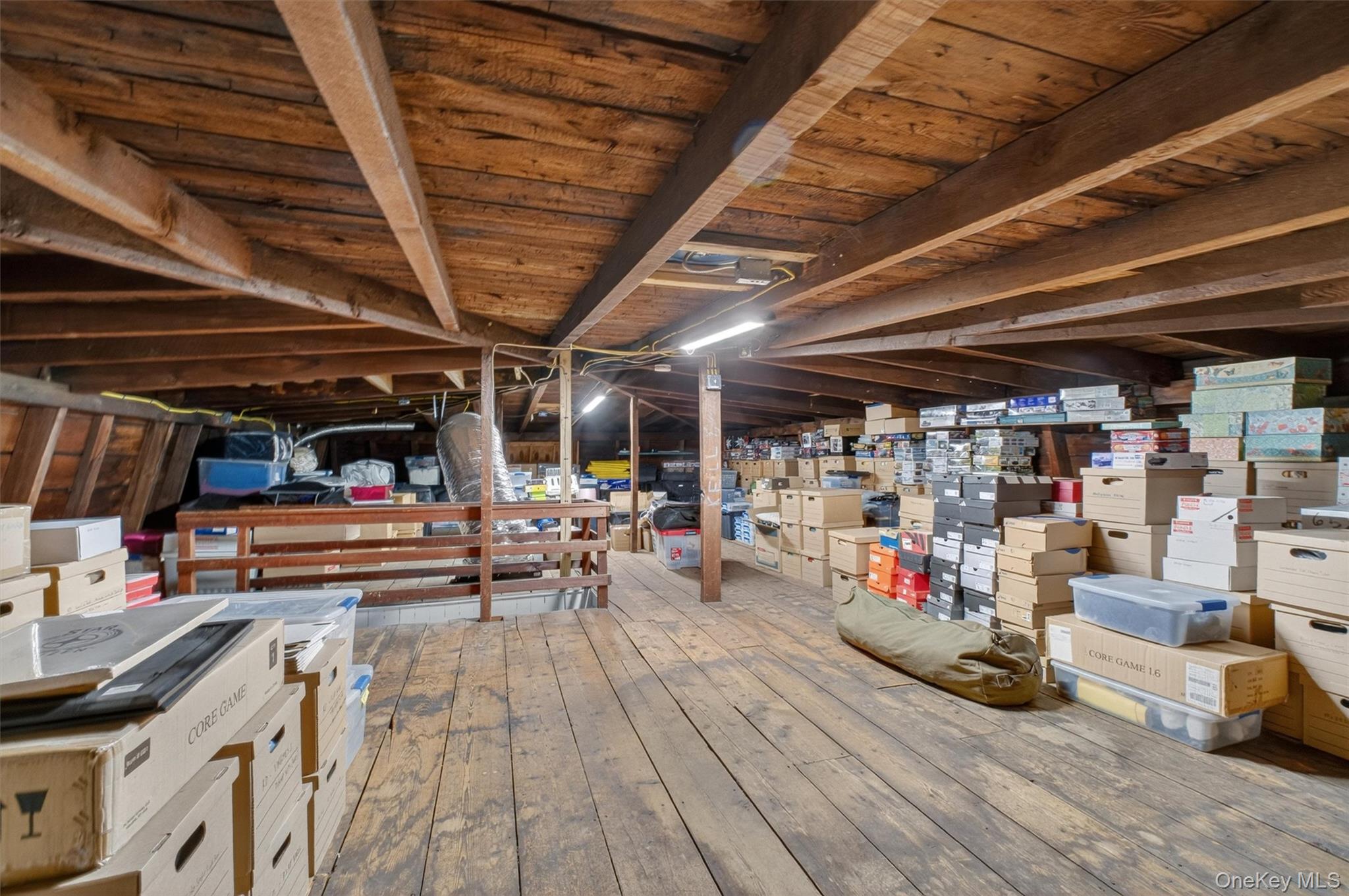 121 Old Glenham Road Fishkill, NY 12524 - Photo 37 of 50 Expansive attic space featuring exposed wood beam ceiling and wood-finish flooring.