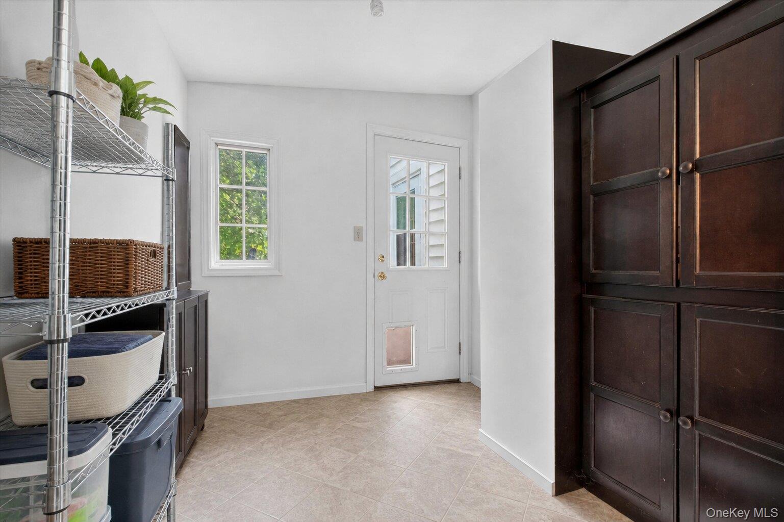 121 Old Glenham Road Fishkill, NY 12524 - Photo 39 of 50 Mud room with storage cabinetry and access to outside.