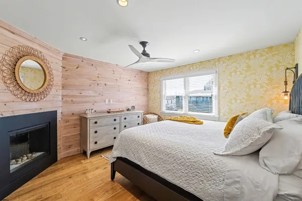 a bedroom with a bed and a fireplace