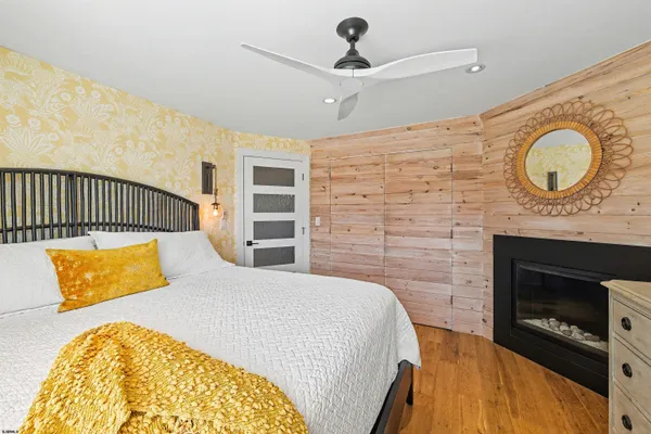 a bedroom with a bed and a fireplace