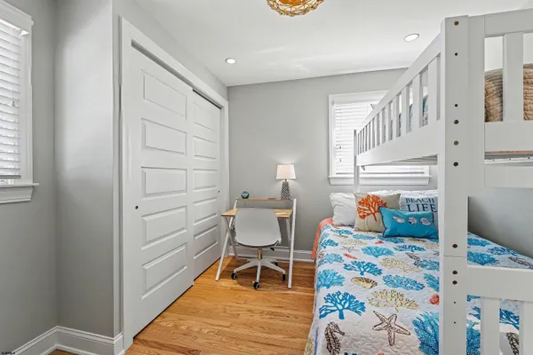 a bedroom with a bed and a chair