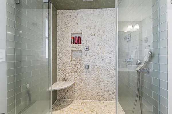 a bathroom with a shower and a toilet