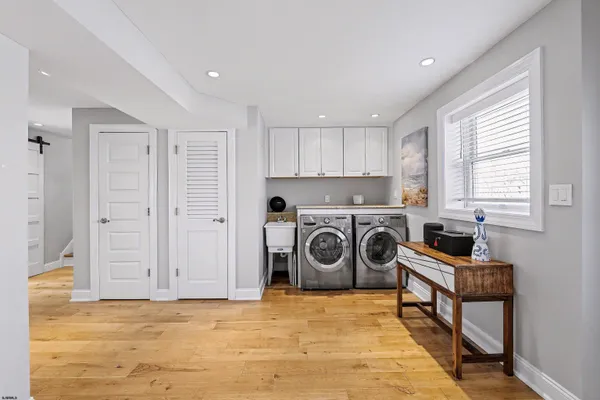 a view of a kitchen with washer and dryer