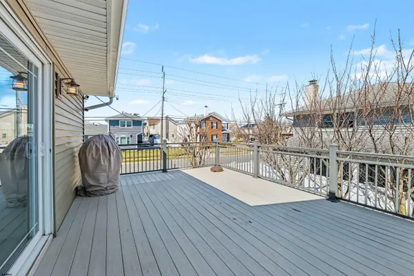 a view of a balcony with wooden floor