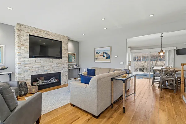 a living room with furniture fireplace and flat screen tv