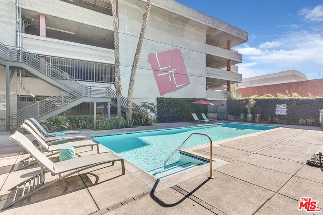 a view of backyard with outdoor seating