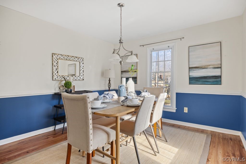 5803 Mill Spring Road Midlothian, VA 23112 - Photo 13 of 48 a view of a dining room with furniture window and wooden floor