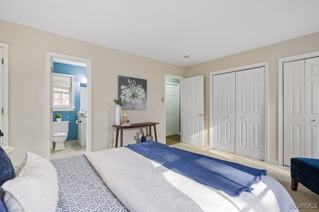 5803 Mill Spring Road Midlothian, VA 23112 - Photo 16 of 48 a bedroom with a bed and a chandelier