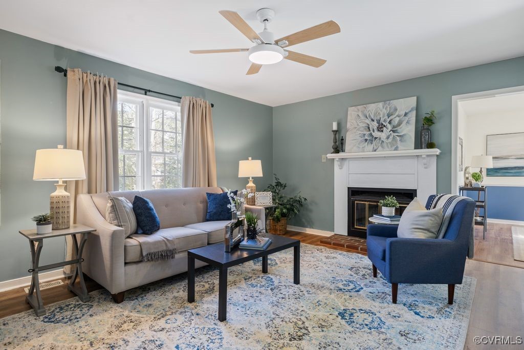 5803 Mill Spring Road Midlothian, VA 23112 - Photo 4 of 48 a living room with furniture and a fireplace