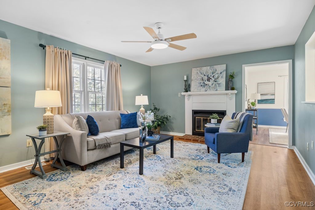 5803 Mill Spring Road Midlothian, VA 23112 - Photo 5 of 48 a living room with furniture and a fireplace