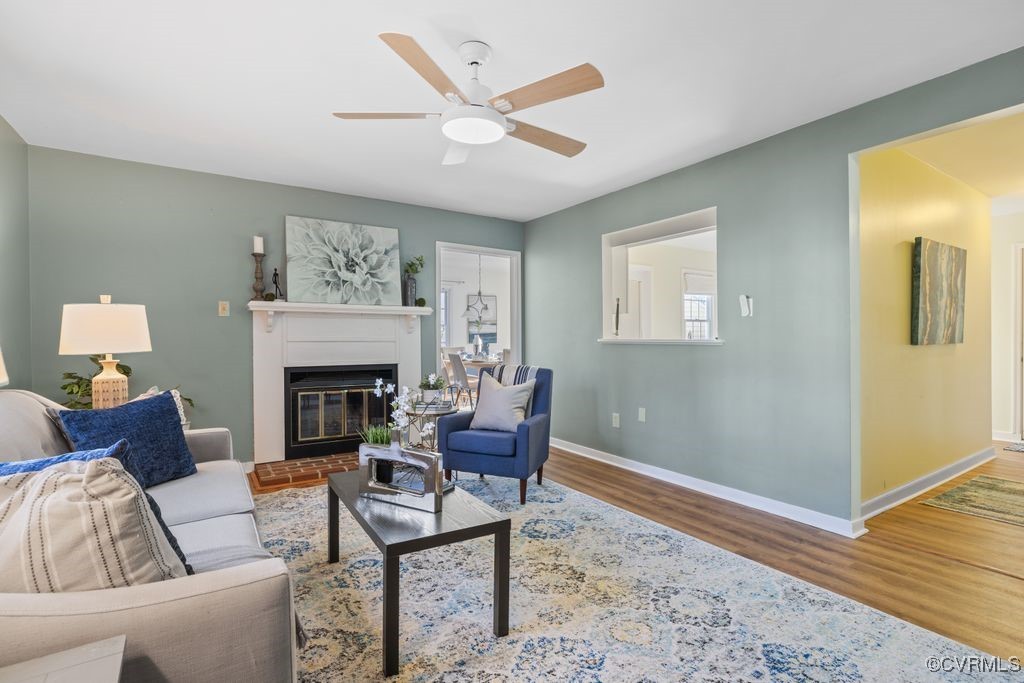 5803 Mill Spring Road Midlothian, VA 23112 - Photo 6 of 48 a living room with furniture and a fireplace