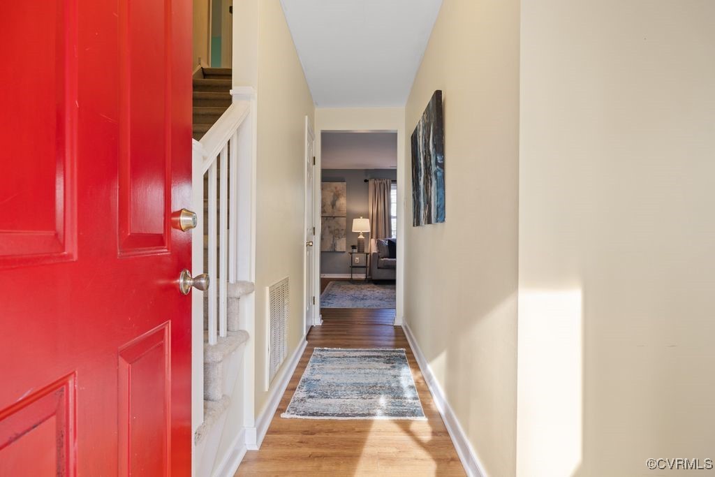 5803 Mill Spring Road Midlothian, VA 23112 - Photo 7 of 48 a view of a hallway with wooden floor and stairs