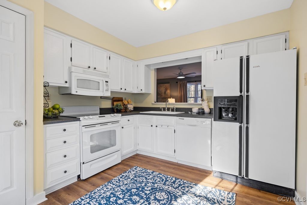 5803 Mill Spring Road Midlothian, VA 23112 - Photo 10 of 48 a kitchen with granite countertop white cabinets and appliances