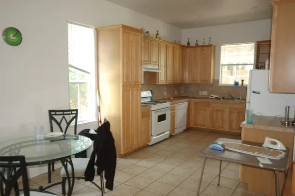 a kitchen with a sink cabinets and window