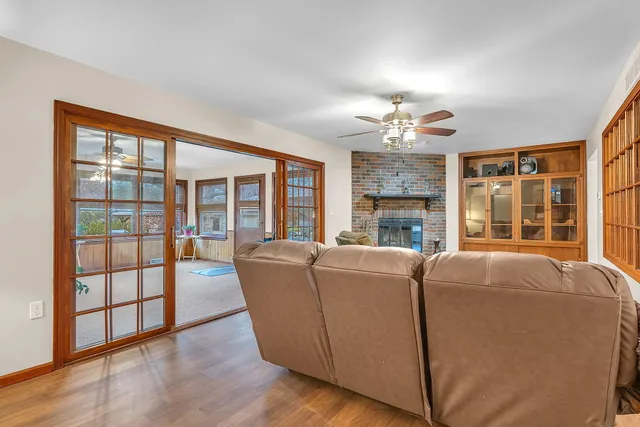 a view of a dining room with furniture and wooden floor