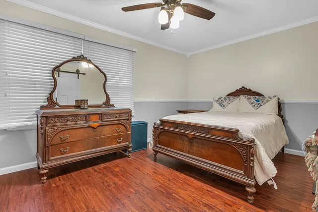 a bathroom with a double vanity sink toilet and a mirror