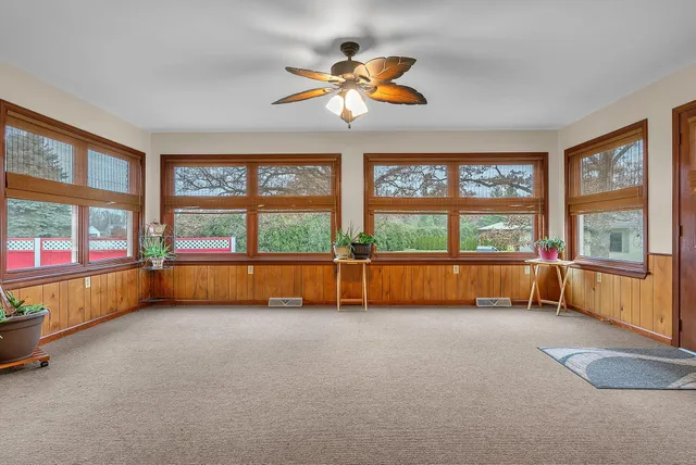 a kitchen with stainless steel appliances granite countertop a sink a stove and a wooden cabinets