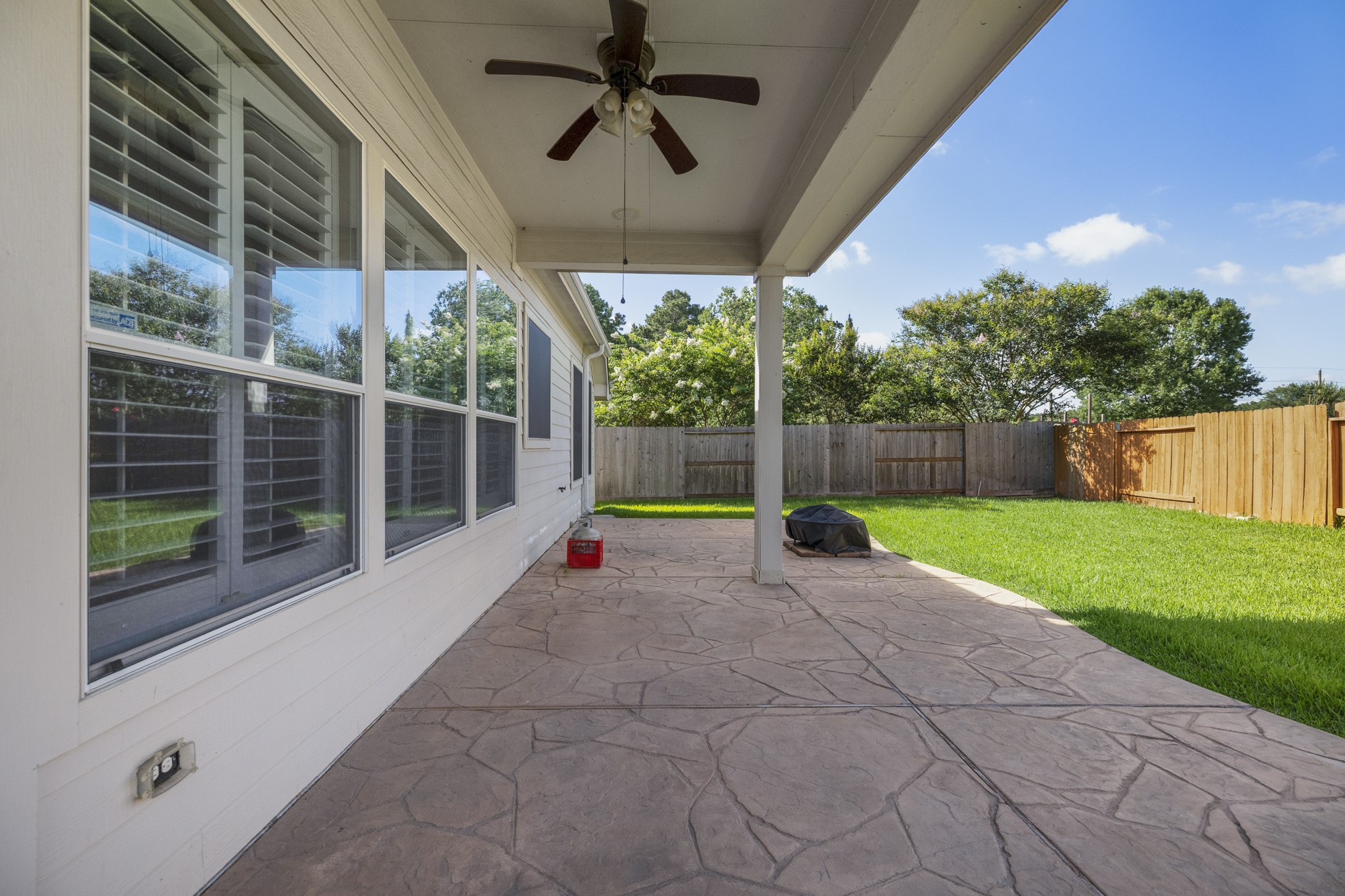 20014 Queens Oak Court Spring, TX 77379 - Photo 27 of 49 a view of a house with a backyard