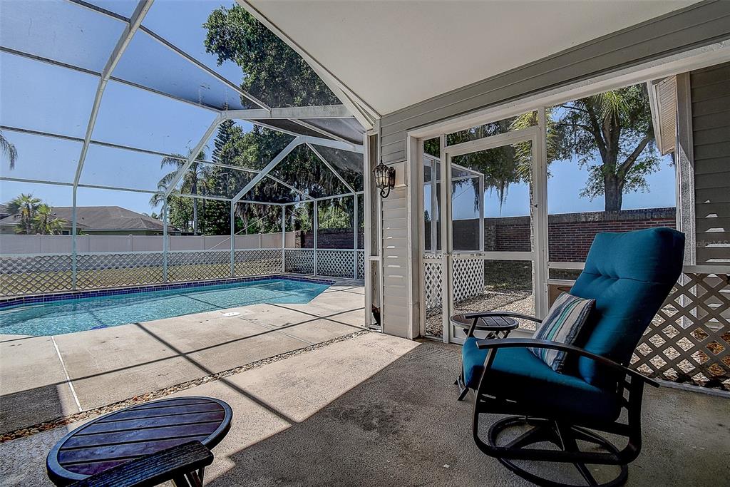 7730 Grimsby Lane New Port Richey, FL 34655 - Photo 20 of 48 a view of a chairs and table in a patio