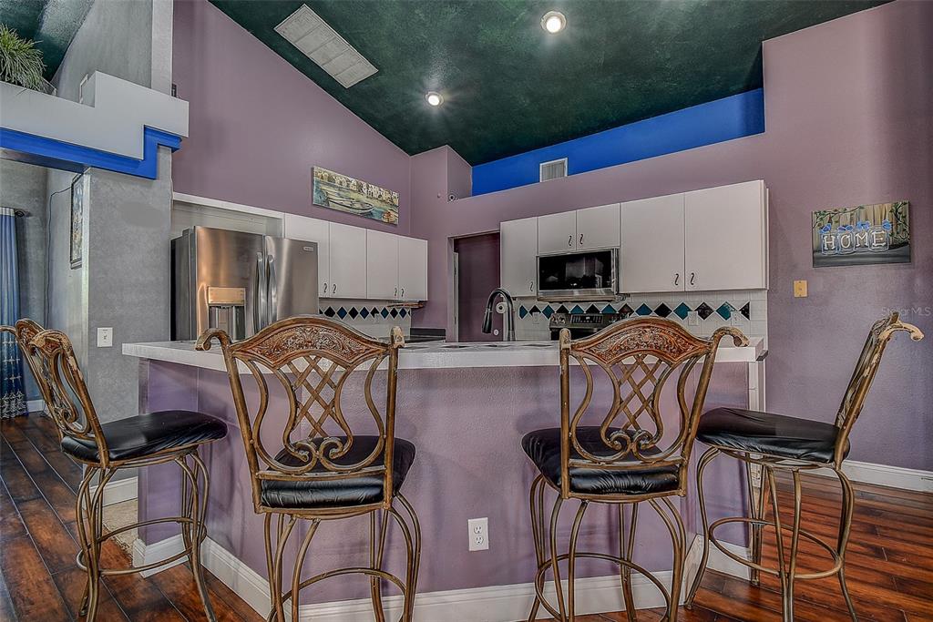 7730 Grimsby Lane New Port Richey, FL 34655 - Photo 34 of 48 a view of a dining room with furniture