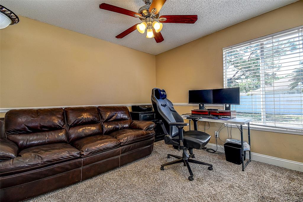 7730 Grimsby Lane New Port Richey, FL 34655 - Photo 40 of 48 a view of a livingroom with workspace and a window