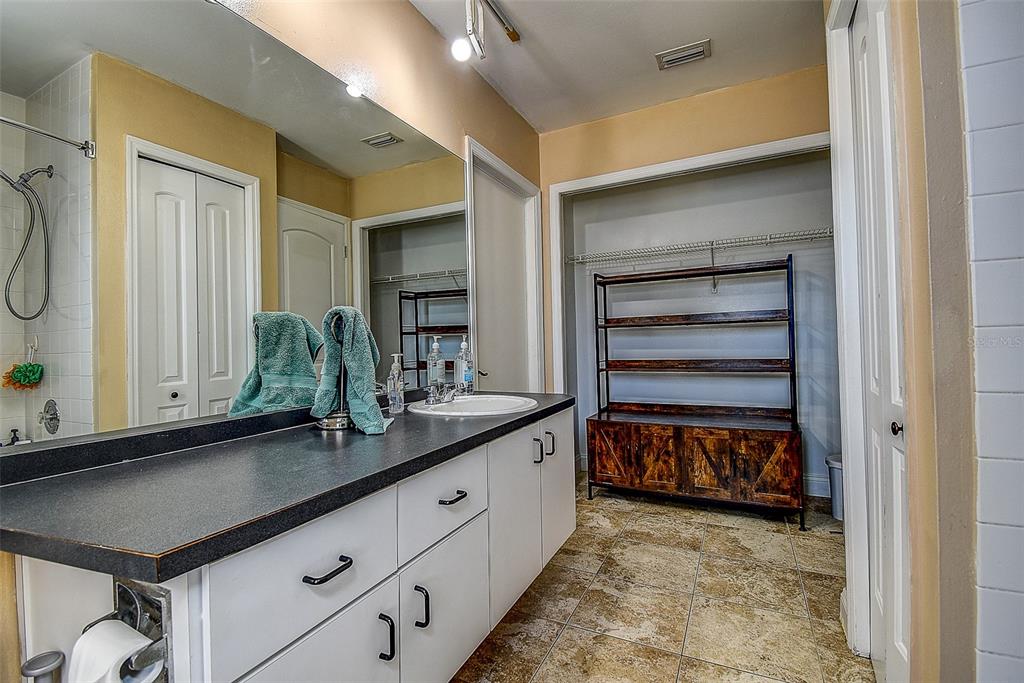 7730 Grimsby Lane New Port Richey, FL 34655 - Photo 42 of 48 a kitchen with a sink and cabinets