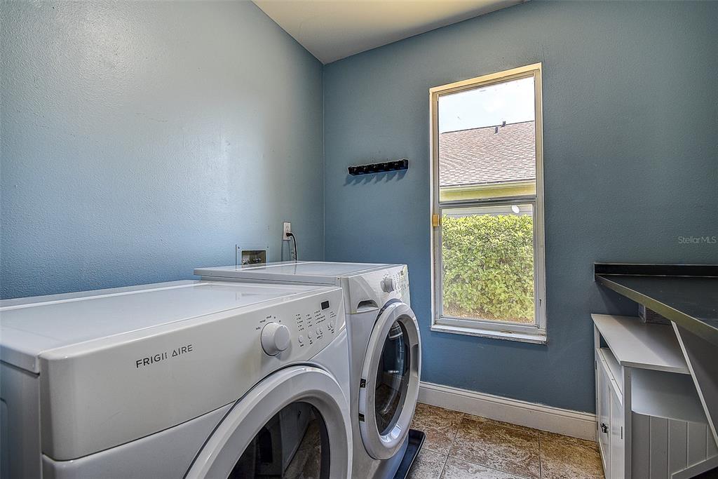 7730 Grimsby Lane New Port Richey, FL 34655 - Photo 48 of 48 a utility room with dryer and washer