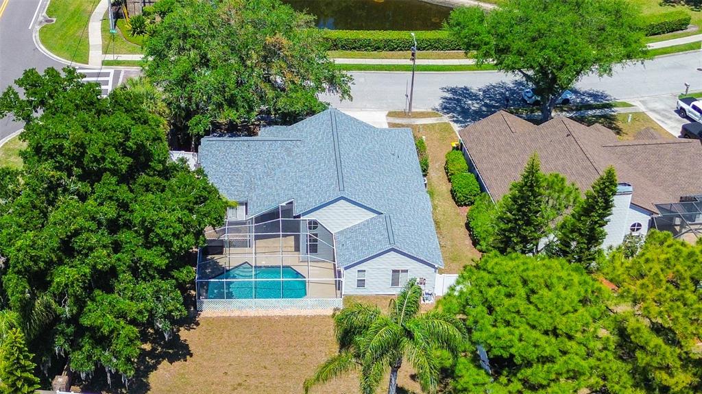 7730 Grimsby Lane New Port Richey, FL 34655 - Photo 9 of 48 an aerial view of a house with outdoor space and a garden