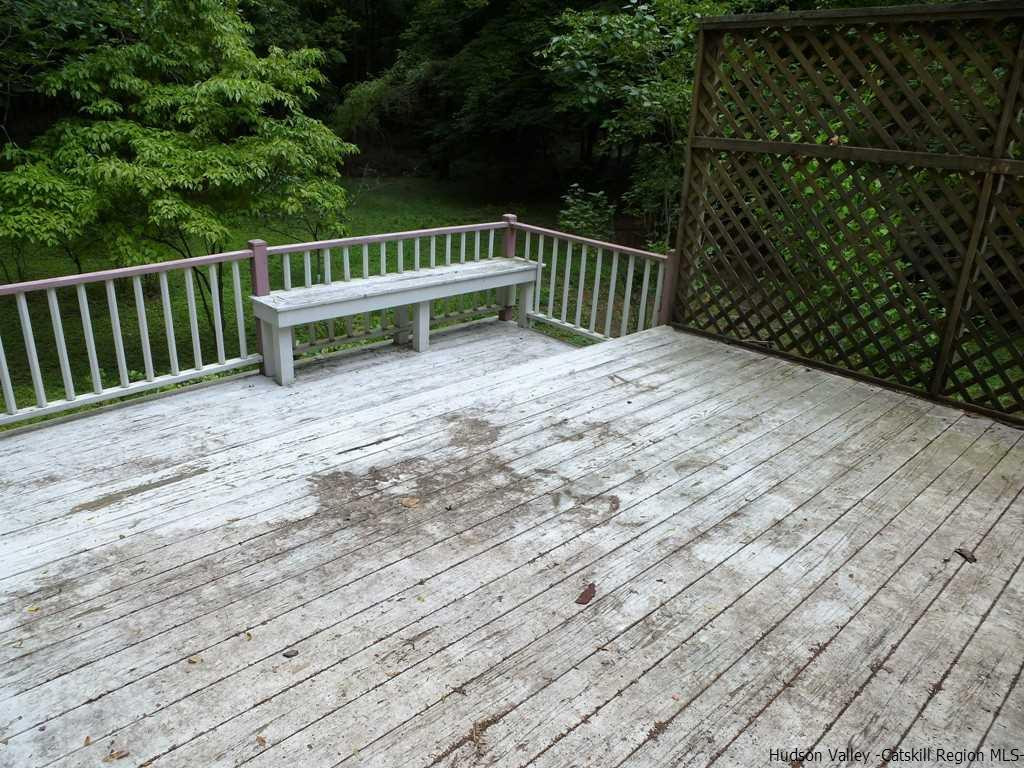 30 Peak Road Stone Ridge, NY 12484 - Photo 20 of 22 a view of balcony with wooden floor and fence
