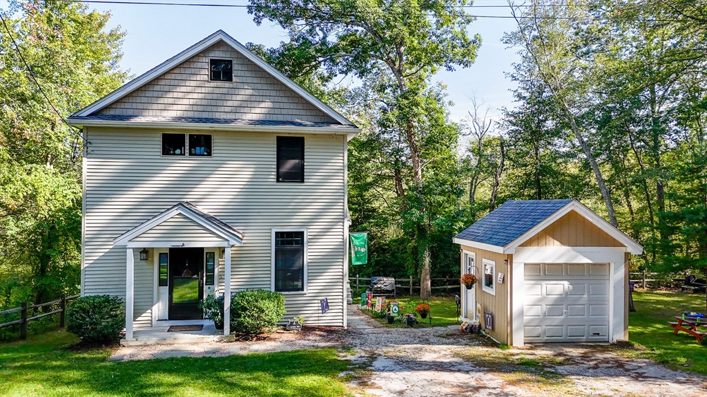 6 Edgehill Road Billerica, MA 01862 - Photo 15 of 15 a front view of a house with a yard and garage