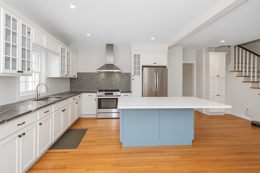 6 Edgehill Road Billerica, MA 01862 - Photo 2 of 15 a large kitchen with stainless steel appliances granite countertop a stove a sink dishwasher and a refrigerator