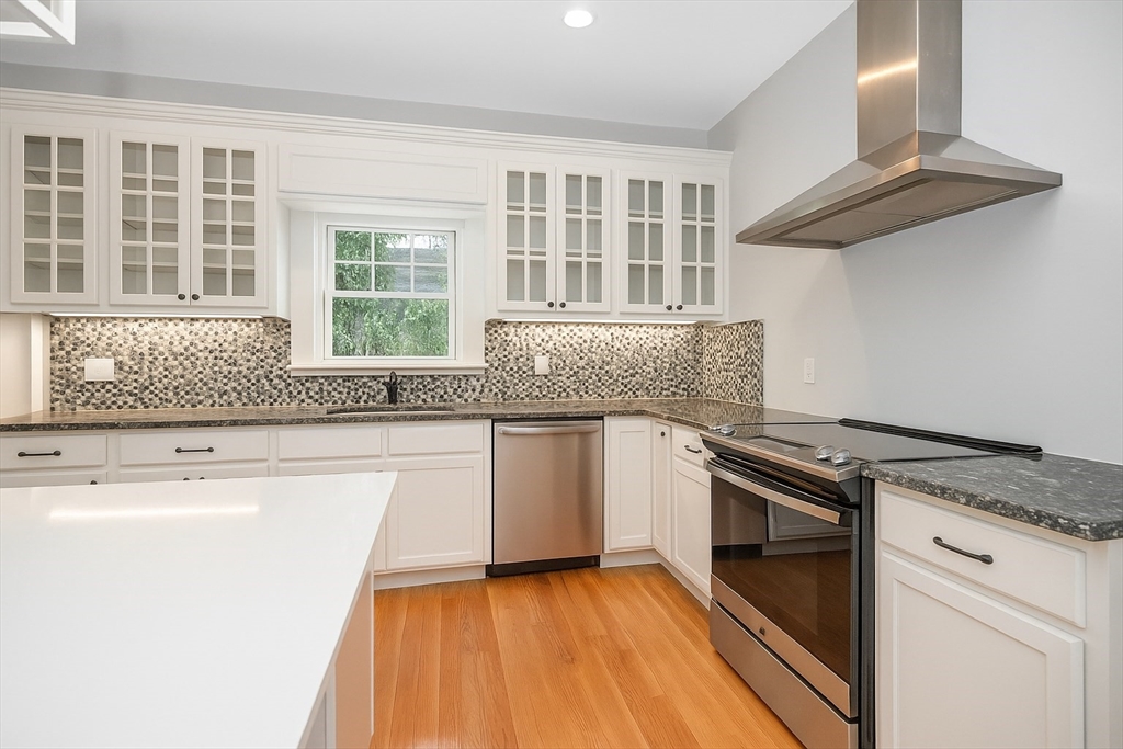 6 Edgehill Road Billerica, MA 01862 - Photo 3 of 15 a kitchen with granite countertop a stove and a sink