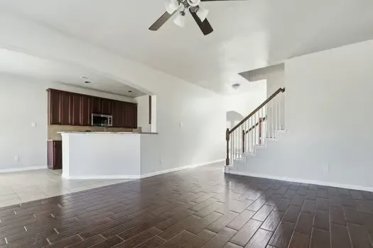 a view of a kitchen with a sink and a microwave