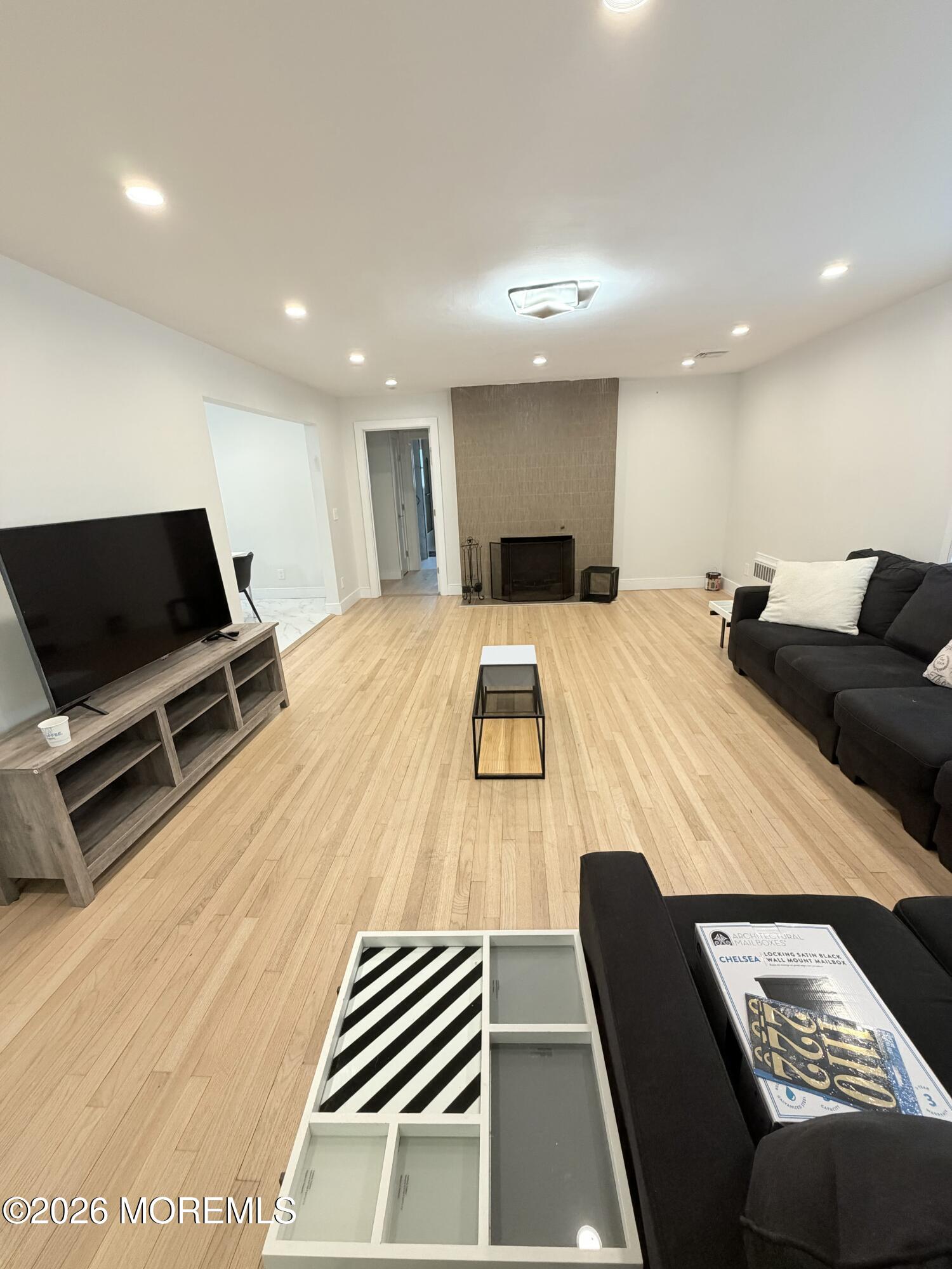 2025 Lesser Parkway Oakhurst, NJ 07755 - Photo 2 of 12 a room with furniture and a flat screen tv
