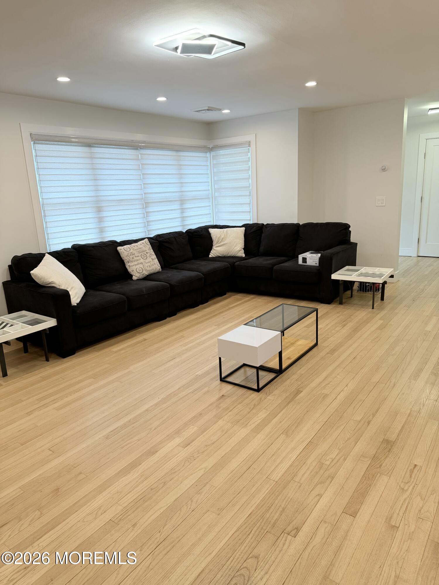 2025 Lesser Parkway Oakhurst, NJ 07755 - Photo 7 of 12 a living room with furniture and wooden floor