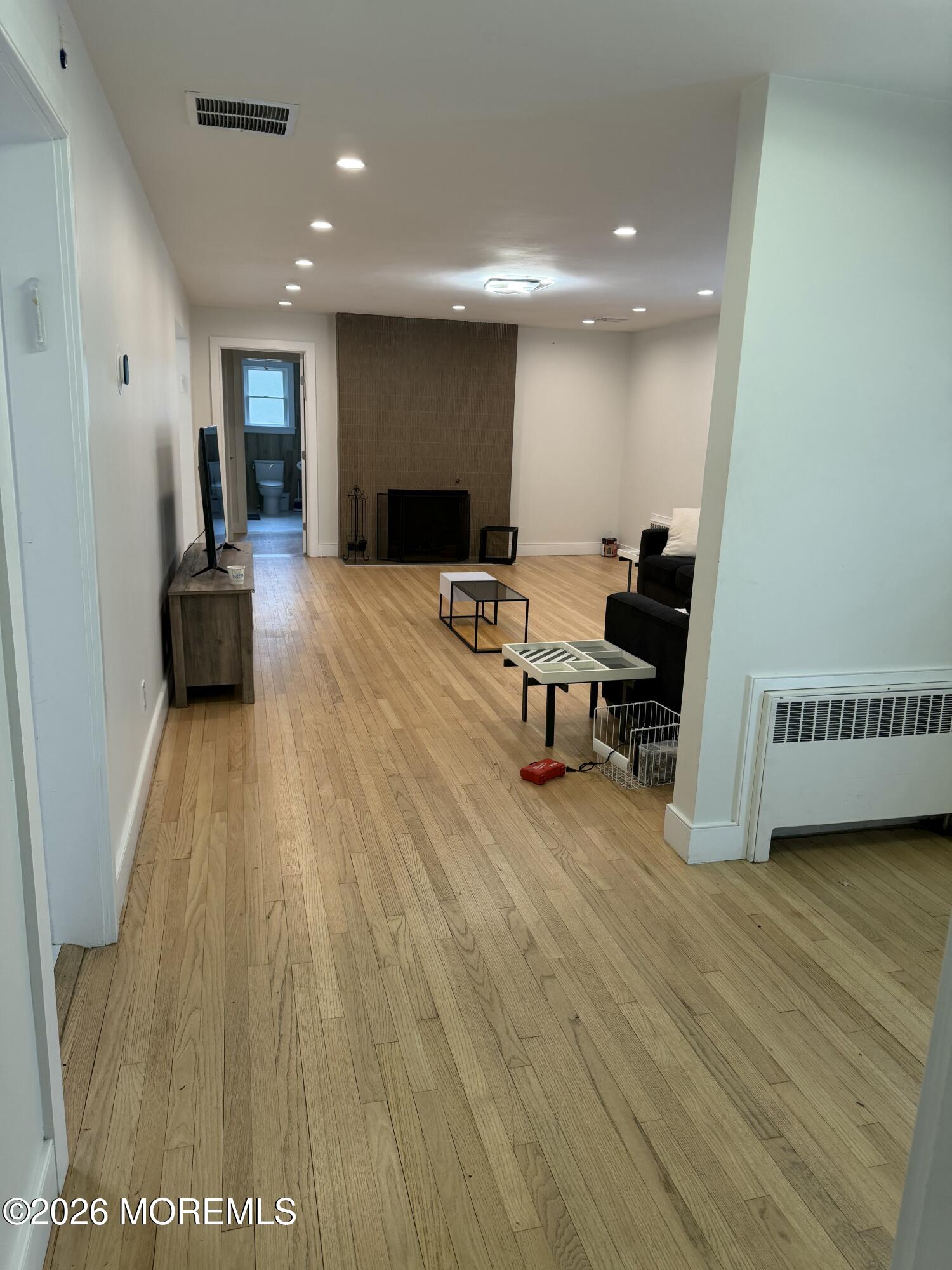2025 Lesser Parkway Oakhurst, NJ 07755 - Photo 8 of 12 a living room with furniture and a wooden floor