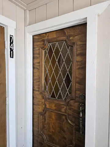 a bathroom with a glass shower door