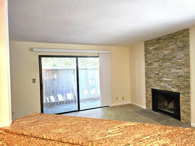 a view of a kitchen with a sink and a window